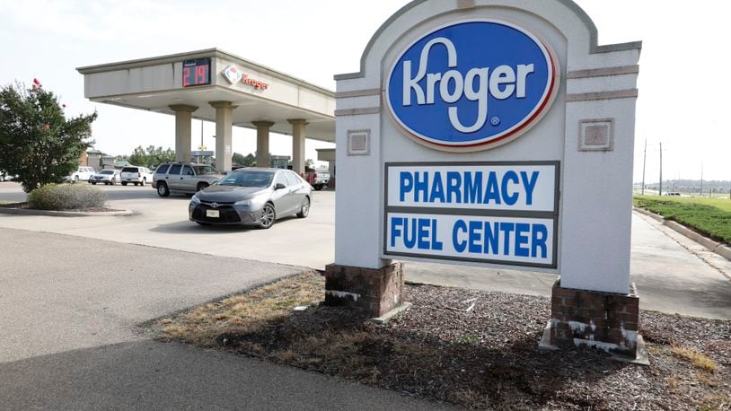 FILE - In this June 26, 2019, file photo a customer exits a Kroger fueling center in Flowood, Miss. Two of the nation’s largest grocers have agreed to merge in a deal that would help them better compete with Walmart, Amazon and other major companies that have stepped into the grocery business. Kroger on Friday, Oct. 14, 2022  bid $20 billion for Albertsons Companies Inc., or $34.10 per share. (AP Photo/Rogelio V. Solis, File)