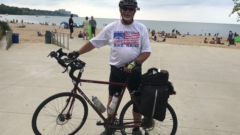 With the novel coronavirus, COVID-19, there cannot be a Great American Bike Rally this year, so co-organizer Dean Bruewer embarked on a 300-plus-mile fundraiser to help fill the void. Pictured is Bruewer at Lake Erie at the end of his 344-mile journey from Fairfield to Cleveland. PROVIDED