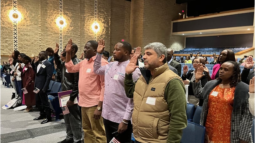 Twenty-nine applicants took their Oath of Allegiance to the United States as they became naturalized U.S. citizens during a ceremony at Springboro High School Thursday, March 21, 2024. ED RICHTER/STAFF