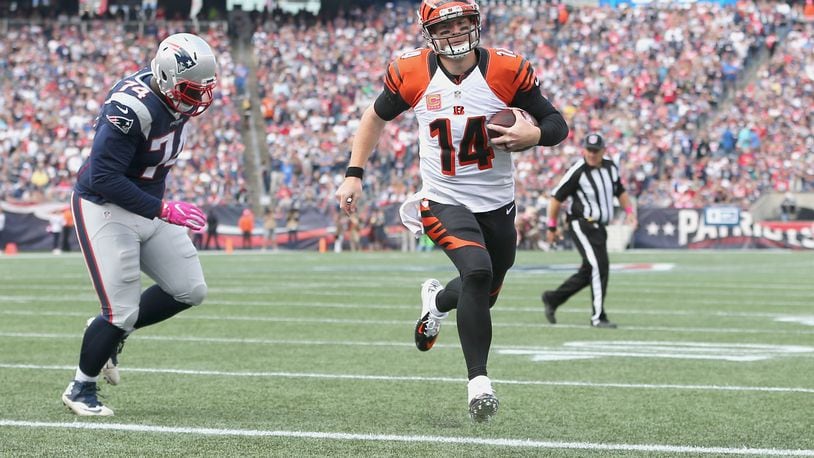 FOXBORO, MA - OCTOBER 16: Andy Dalton #14 of the Cincinnati Bengals runs in a touchdown against the New England Patriots during the game at Gillette Stadium on October 16, 2016 in Foxboro, Massachusetts. (Photo by Jim Rogash/Getty Images)