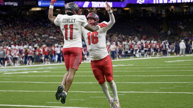 Western Kentucky wide receiver Malachi Corley (11) celebrates his touchdown with Western Kentucky quarterback Austin Reed (16) against South Alabama during the first half of the New Orleans Bowl NCAA college football game in New Orleans, Wednesday, Dec. 21, 2022. (AP Photo/Matthew Hinton)