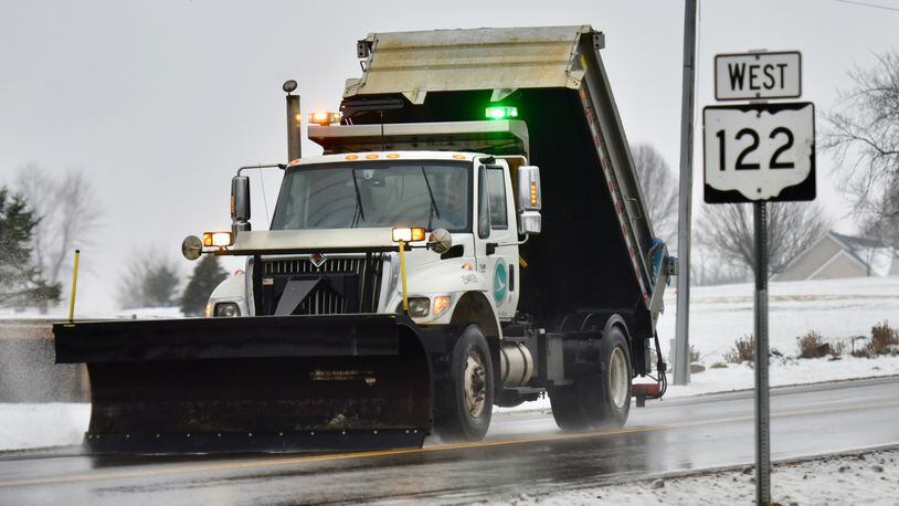 Salt trucks and snow plows worked on roads as a wintry mix fell on the area on Monday, Jan. 8, 2018. NICK GRAHAM / STAFF