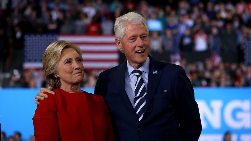 RALEIGH, NC - NOVEMBER 08: Democratic presidential nominee former Secretary of State Hillary Clinton (L) and her husband former U.S. President Bill Clinton look on during a campaign rally at North Carolina State University on November 8, 2016 in Raleigh, North Carolina.  (Photo by Justin Sullivan/Getty Images)