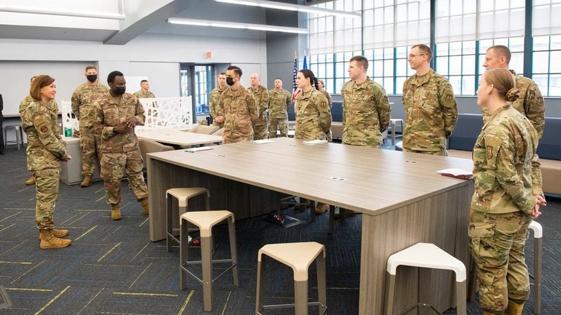 Chief Master Sergeant of the Air Force JoAnne S. Bass, talks with Airmen assigned to the Air Force Life Cycle Management Center, during her visit to AFLCMC Simulation building in June 2021, as part of a multiday tour of Wright-Patterson Air Force Base. 
(U.S. Air Force photo by Wesley Farnsworth)