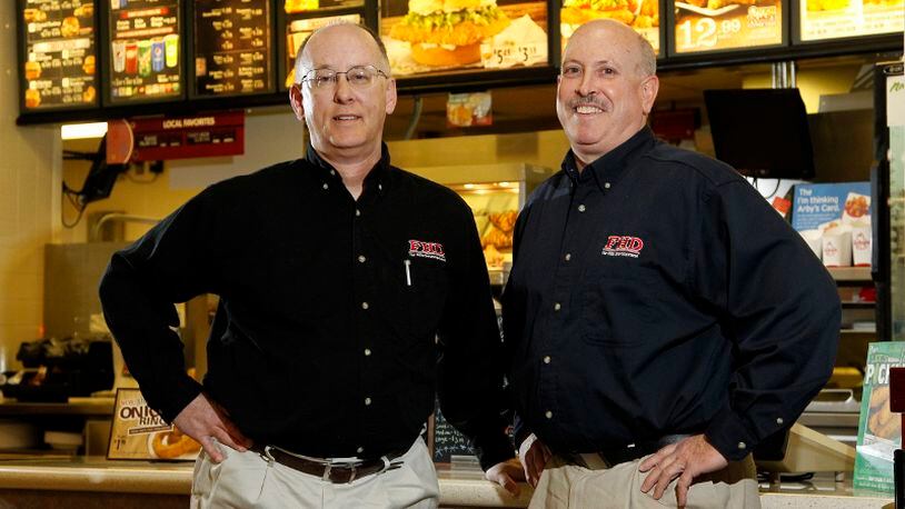 Ken Riddle (left) and Chuck Doran are the co-founders of Far Hills Development LLC and operate over a dozen Lee’s Famous Recipe restaurants. LISA POWELL/STAFF