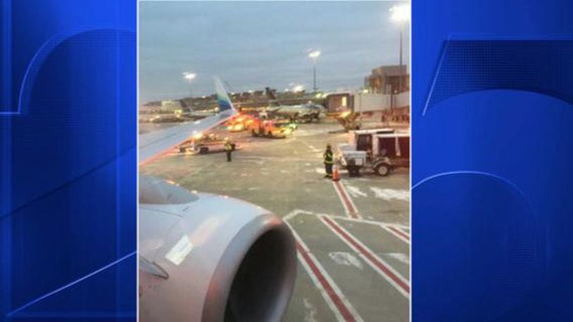 A passenger snapped a shot of an Alaska Airlines plane, leaving Logan International Airport, that hit a deicing truck on the runway. The left wing was damaged.