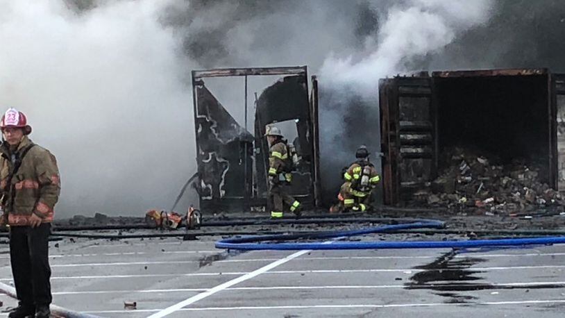 Storage containers holding fireworks burst into flames at a South Carolina fireworks business.