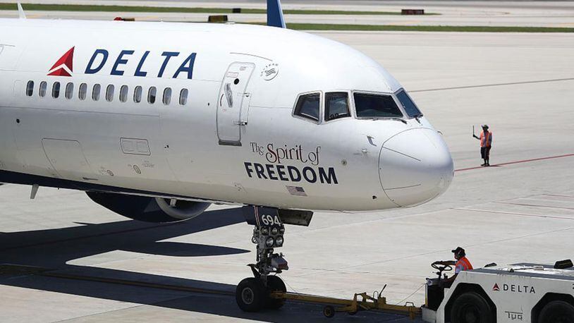 A Delta airlines plane on the tarmac of the Fort Lauderdale-Hollywood International Airport on July 14, 2016 in Fort Lauderdale, Florida. The airline is being solicited by other states after Georgia officials threatened a $50 million sales tax break because Delta ended a NRA discount.