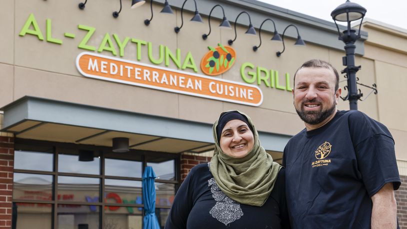 Maha Kayed, left, and Mohammad Jarabah have opened their Mediterranean cuisine restaurant, Al Zaytuna Grill, at Bridgewater Falls in Fairfield Township. NICK GRAHAM/STAFF