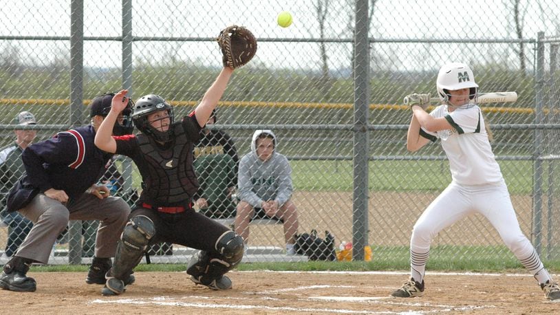 Fenwick catcher Claudia Miller has to stretch for a high pitch April 12 during an 11-0 loss to visiting McNicholas in Greater Catholic League Coed Division softball action. RICK CASSANO/STAFF