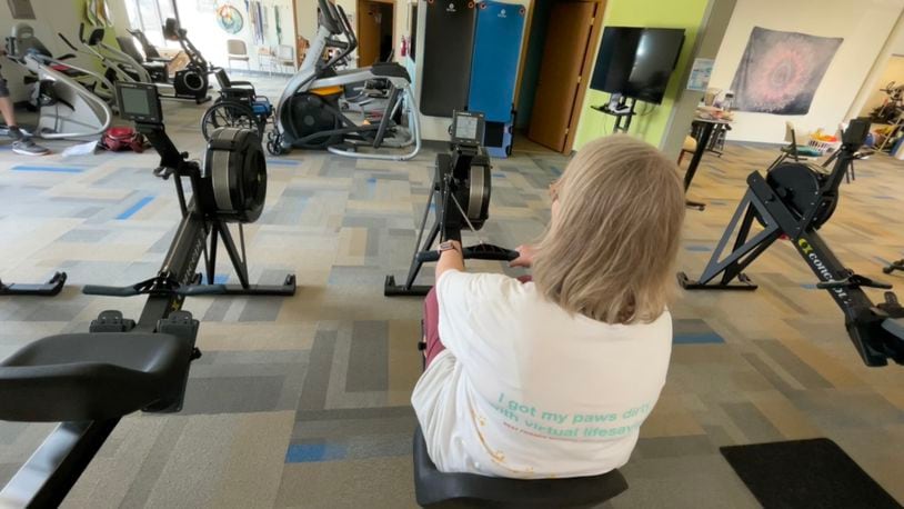 NeuroFit Gym on Tonya Trail in Fairfield Twp. bought six new adaptive rowing machines with a $25,000 Christpher and Dana Reeve Foundation grant. Pictured is Becky Farrell, of North Avondale, using one of the new rowing machines on Tuesday, Aug. 1, 2023. MICHAEL D. PITMAN/STAFF