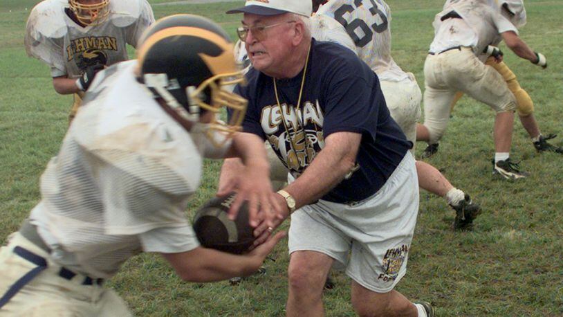 08-20-1997 Sidney Lehman Hign School football coach Chuck Asher, 67, works with his team Wednesday, teaching plays for the fall season. He is a veteran of 40 to 45 years in high school football. This year he is coaching his grandson.
