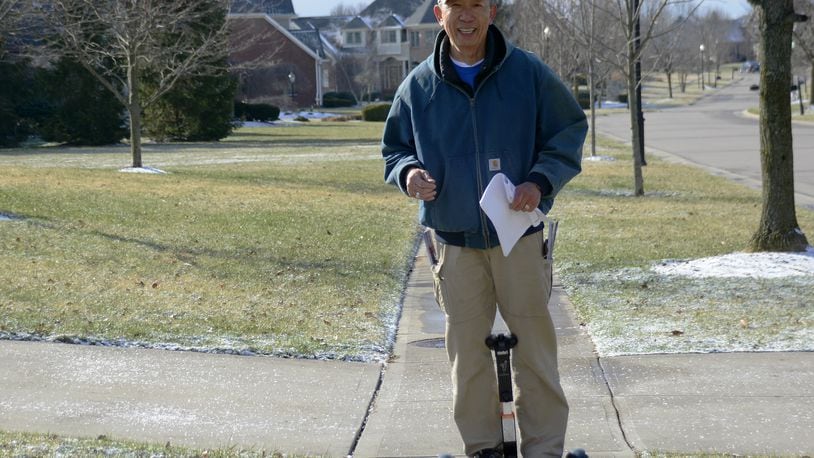 West Chester Twp. Trustee Lee Wong is out campaigning for Butler County Commission earlier this month. Wong is facing incumbent commissioner Cindy Carpenter for the GOP nomination in the May 8 primary. MICHAEL D. PITMAN/STAFF