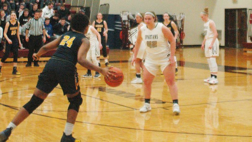 Monroe’s Olivia Wells-Daniels (24) dribbles toward Valley View’s Lauren Legate during Wednesday night’s Division II sectional game at Lebanon. Valley View won 41-36. RICK CASSANO/STAFF