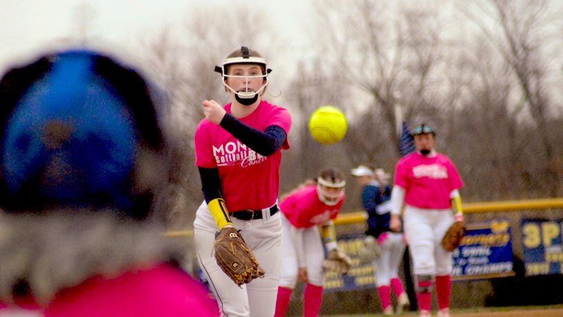 Monroe junior Regan Swartz sends a practice pitch to the plate in between innings of a game against Roger Bacon on Tuesday. The Hornets won 18-2. Chris Vogt/CONTRIBUTED