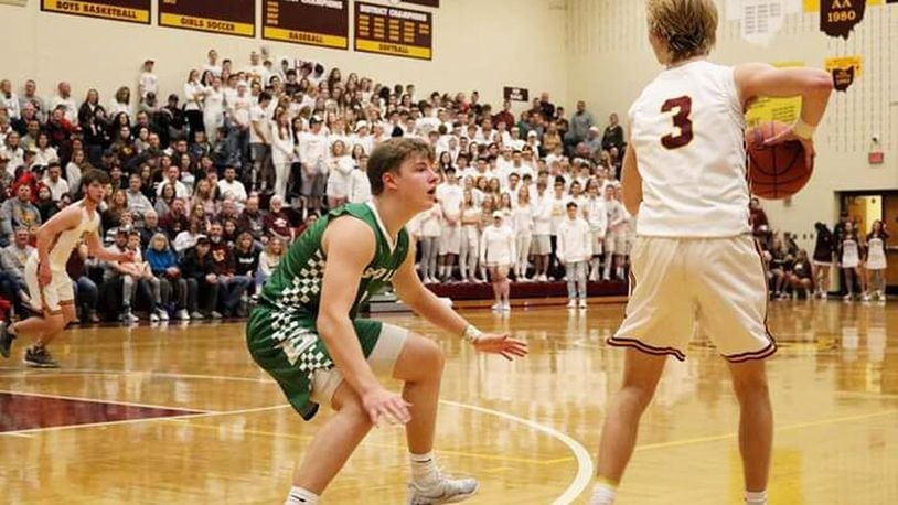 Badin’s Nathan Hegemann guards Dylan Zimmerman of Ross during Saturday night’s game in Ross Township. Badin won 51-38. CONTRIBUTED PHOTO BY TERRI ADAMS