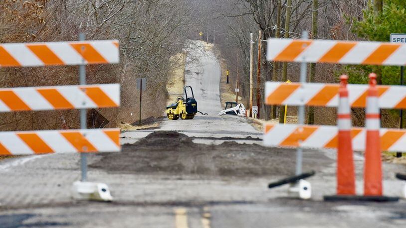 Monroe closed Butler-Warren Road for two weeks in January and February 2018 to work on potholes caused by big jumps in temperatures. Crews were working on the road on Thursday, Feb. 1, 2018. NICK GRAHAM / STAFF