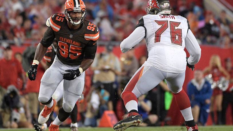 Tampa Bay Buccaneers offensive tackle Donovan Smith (76) blocks against Cleveland Browns defensive end Myles Garrett (95) during the first half of an NFL preseason football game Saturday, Aug. 26, 2017, in Tampa, Fla. (AP Photo/Phelan M. Ebenhack)