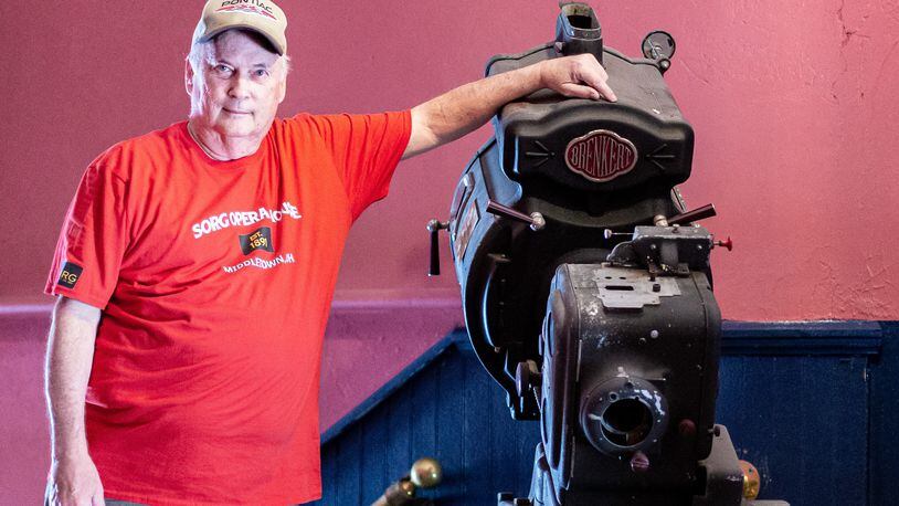 Bob Melloh pictured with one of the Sorg theater’s original 35-millimeter projectors. CONTRIBUTED