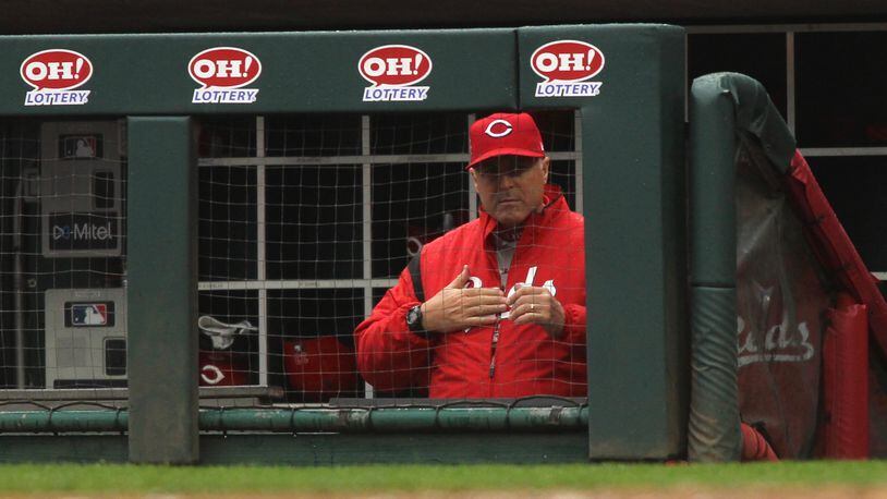 Reds manager Bryan Price calls a play during a game against the Cardinals on Sunday, April 15, 2018, at Great American Ball Park in Cincinnati. David Jablonski/Staff
