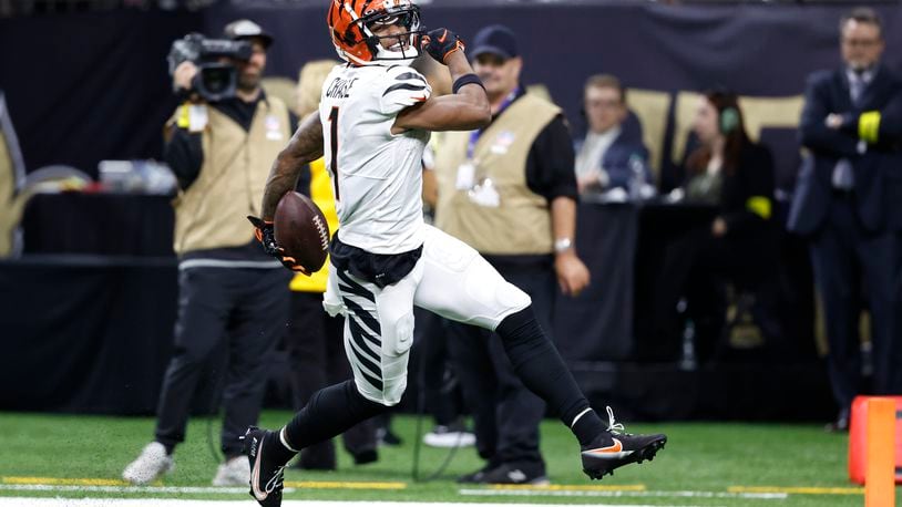 Cincinnati Bengals wide receiver Ja'Marr Chase (1) smiles as he runs for a touchdown against the New Orleans Saints during the second half of an NFL football game in New Orleans, Sunday, Oct. 16, 2022. (AP Photo/Butch Dill)