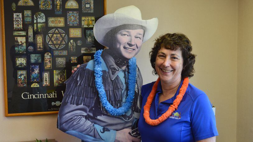 Joan Potter-Sommer poses with a life-size Roy Rogers cutout that has been in her office at Oxford Seniors for years. Potter-Sommer officially retires this week from her position as executive director. CONTRIBUTED/BOB RATTERMAN