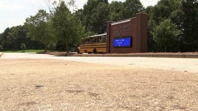 A Georgia middle school teacher has been arrested and charged with molesting a student at a Clayton County school.