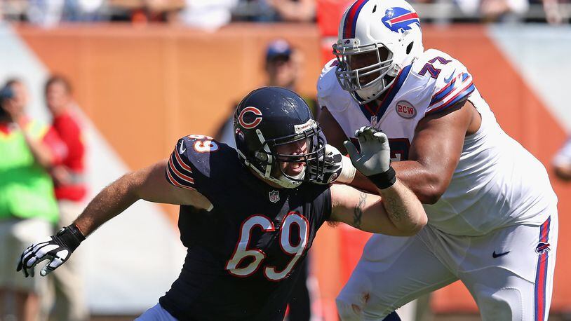 CHICAGO, IL - SEPTEMBER 07: Cordy Glenn #77 of the Buffalo Bills blocks Jared Allen #69 of the Chicago Bears at Soldier Field on September 7, 2014 in Chicago, Illinois. The Bills defeated the Bears 23-20 in overtime. (Photo by Jonathan Daniel/Getty Images)