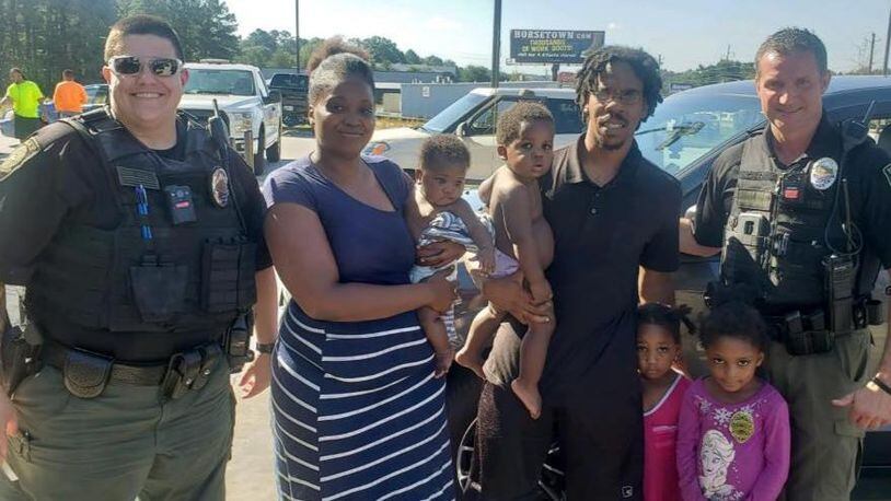 Two Jonesboro police officers helped pay for a family’s car insurance and lunch after a traffic stop Tuesday. (Photo: Jonesboro Police Department)