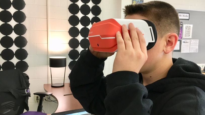 A new virtual reality art program has students at Middletown High School learning computer coding and creating their own computer animated works of art. Students then can immerse themselves in their own art work via virtual reality goggles (pictured). (Photo By Michael D. Clark/Journal-News)