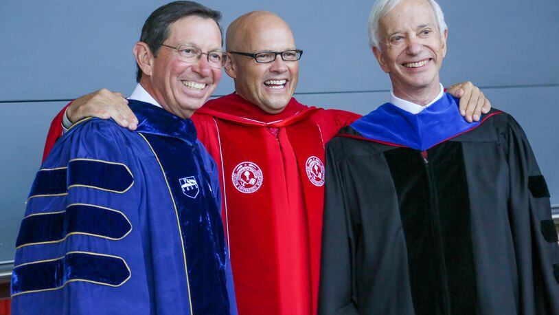 Miami University President Gregory Crawford, center, stands with former presidents David Hodge and James Garland during his inauguration ceremony Oct. 10 at Millett Hall in Oxford. GREG LYNCH / STAFF