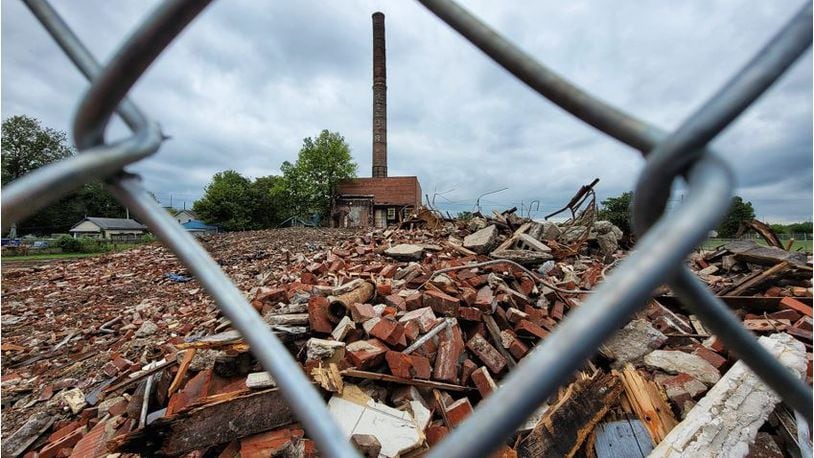 The new owner of the French Bauer Dairy property has demolished the abandoned building that was prone to fires but plans to keep the structure with the smokestack. He has offered plans for a replacement building where he wants to store construction equipment. NICK GRAHAM/STAFF