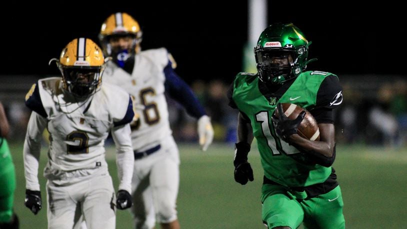 Northmont's Rod Moore scores on a 60-yard reception in the fourth quarter against Springfield on Friday, Sept. 18, 2020, in Clayton. David Jablonski/Staff