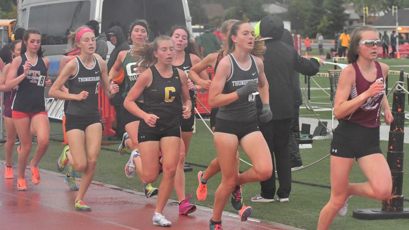 Lakota East's Carly Spletzer (second from right) and Kelsi Harris qualified for state in the 3,200-meter run. Greg Billing/Contributed