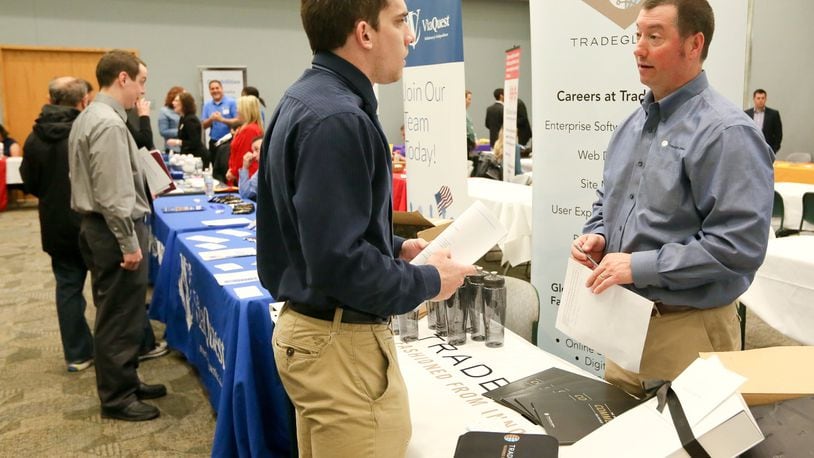 Tyler Meier of Oxford, talks with Tom Dalessandro of TradeGlobal during the Miami University Regional Butler County Job Fair, Wednesday, April 6, 2016. GREG LYNCH / STAFF
