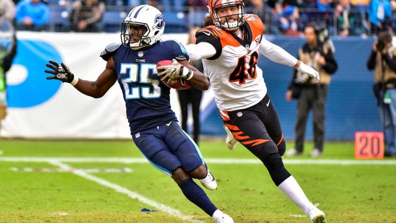 NASHVILLE, TN - NOVEMBER 12: Corner Back Adoree’ Jackson #25 of the Tennessee Titans carries the ball against Long Snapper Clark Harris #46 of the Cincinnati Bengals at Nissan Stadium on November 12, 2017 in Nashville, Tennessee. (Photo by Frederick Breedon/Getty Images)