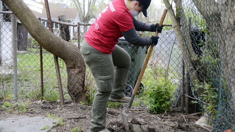 A community volunteer fair will be hosted by OhioMeansJobs-Butler County, LoveWorks and the Fairfield Lane Library Saturday afternoon at the job center on Dixie Highway in Fairfield. Habitat for Humanity is one of the nearly 20 nonprofit organizations seeking volunteers to help the community. Pictured is a volunteer in April 2019 at Habitat for Humanity’s Rock the Block in Fairfield Twp. MICHAEL D. PITMAN/FILE