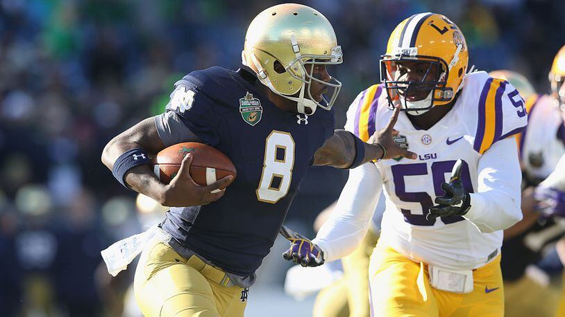 NASHVILLE, TN - DECEMBER 30: Malik Zaire #8 of the Notre Dame Fighting Irish runs with the ball against the LSU Tigers during the Franklin American Mortgage Music City Bowl at LP Field on December 30, 2014 in Nashville, Tennessee. (Photo by Andy Lyons/Getty Images)