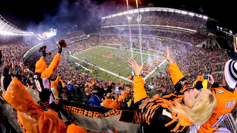 Fans cheer on the Cincinnati Bengals before their 18-16 loss to the Pittsburgh Steelers in the AFC wild card playoff game Saturday, Jan. 9 at Paul Brown Stadium in Cincinnati. NICK GRAHAM/STAFF