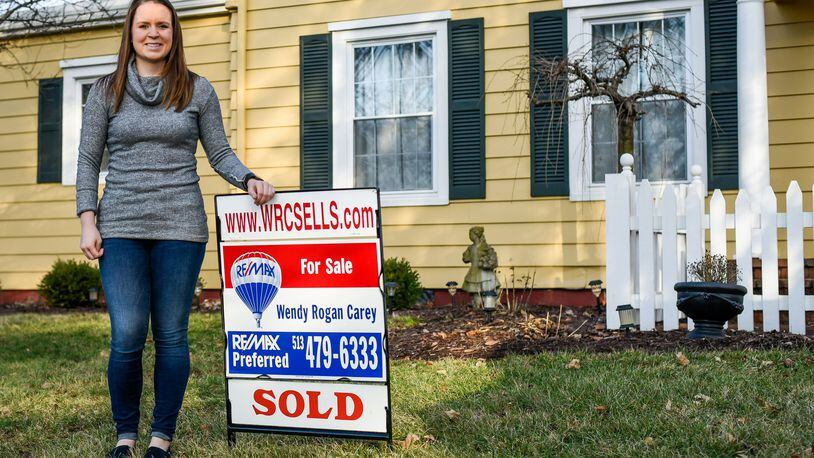 Mollee Schierloh stands in front of the home she recently bought in Middletown. The local home sales market almost matched 2005 numbers, a sign the economy continues to rebound following the recession. NICK GRAHAM/STAFF