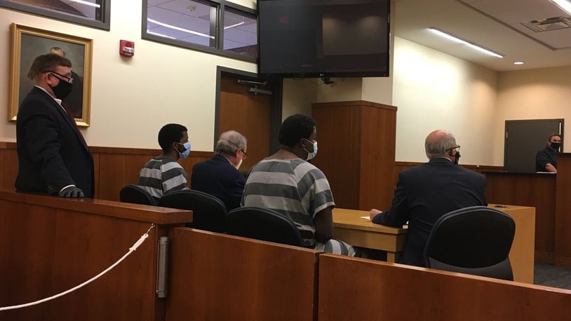 Left to right, Patrick Johnson-Tucker, attorney, Chris Atkins, Nicholas Johnson-Tucker, with attorney Jeffrey Milbauer, in Middletown Municipal Court in May for a hearing. The brothers are charged with robbery and kidnapping for allegedly robbing the CVS on May 2 and tying up the employees. LAUREN PACK/STAFF