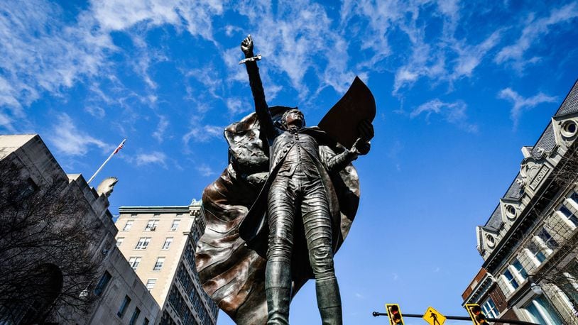 Alexander Hamilton, the city of Hamilton's namesake, stands in the city's downtown, welcoming travelers and pedestrians on High Street. NICK GRAHAM/FILE