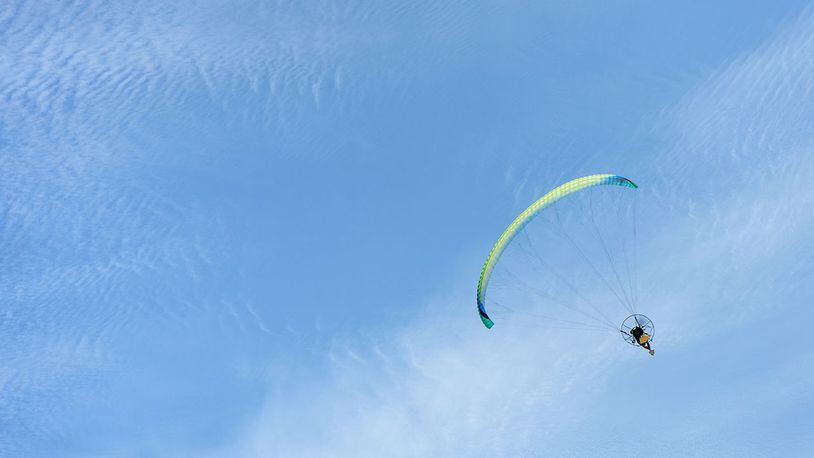 Stock photo of powered paragliding.