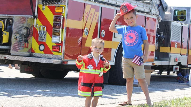 Children and their families enjoy a previous Touch-A-Truck event where attendees got an opportunity to see and learn more about official vehicles and to meet police, fire and community services personnel. CONTRIBUTED
