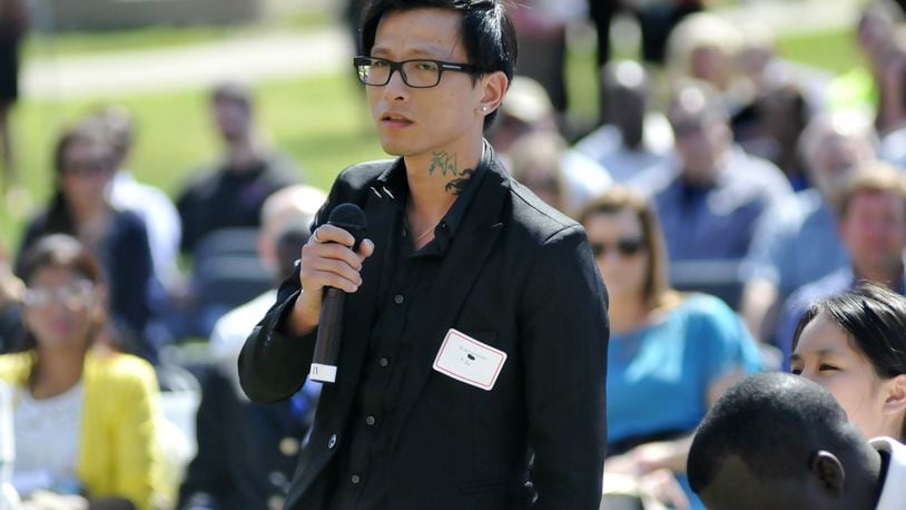 During a roll call of the 72 applicants for citizenship to the United States, Sky Shuxiang Ni, from China, states his name and country of origin during the naturalization ceremony Thursday afternoon on the campus of Miami University Hamilton.