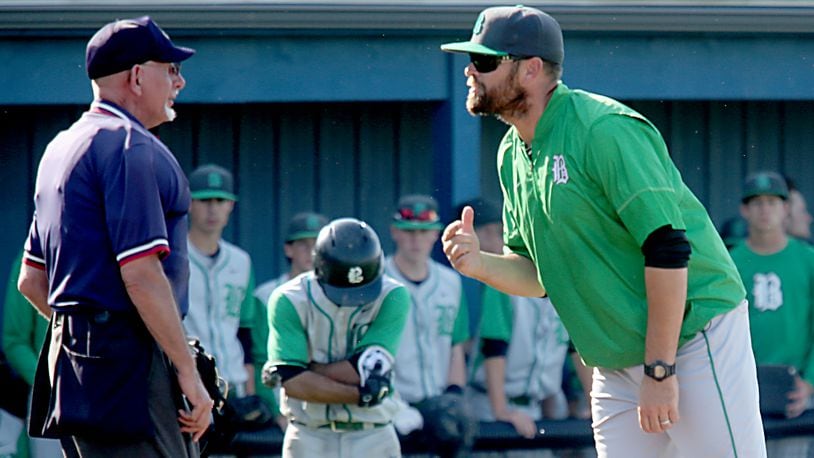 Badin baseball coach Brion Treadway discusses a call with the home-place umpire during a Division II sectional final against Chaminade Julienne at Miamisburg on May 18, 2017. JOURNAL-NEWS FILE PHOTO