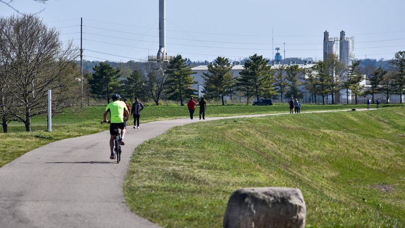 A sunny day brought a lot of people out to the bike path along the Great Miami River Wednesday, April 22 in Hamilton. NICK GRAHAM / STAFF