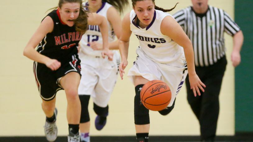 Middletown guard Alexis Shealey (5) leads a fast break during a Division I sectional girls basketball game agianst Milford at Sycamore on Feb. 13, 2016. GREG LYNCH/STAFF