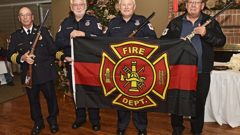 Four Madison Township firefighters were honored during their holiday dinner for 40 years of service each with the Madison Township Fire Department. Left to right, Deputy Chief Rife Denlinger, Denzil Ferguson, Bob Strassberger and Andy Bolen were recognized as firefighters of the year for 2017 and presented with plaques, flags and custom engraved rifles. The group pictured here represents 160 years of service to Madison Township. NICK GRAHAM/STAFF