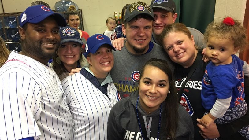 Friends and family surround Middletown native and Chicago Cubs star Kyle Schwarber shortly after the team won Game 7 of the World Series this week. CONTRIBUTED.